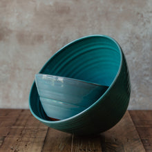 Load image into Gallery viewer, Large turquoise bowl with a smaller turquoise bowl inside at an angle

