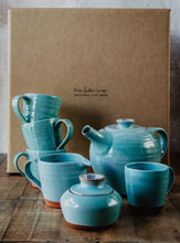 Load image into Gallery viewer, Turquoise tea set in front of brown gift box
