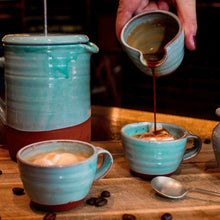 Load image into Gallery viewer, 2 turquoise espresso cups with ice cream in them, espresso coffee being poured into one of the espresso cups from a mini jug with a turquoise coffee pot in the back ground
