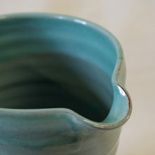 Load image into Gallery viewer, Rim and spout of a turquoise jug

