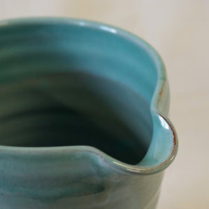 Rim and spout of a turquoise jug
