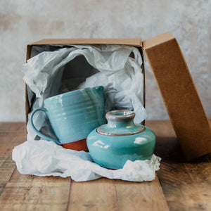 Turquoise milk jug and sugar bowl in a brown gift box